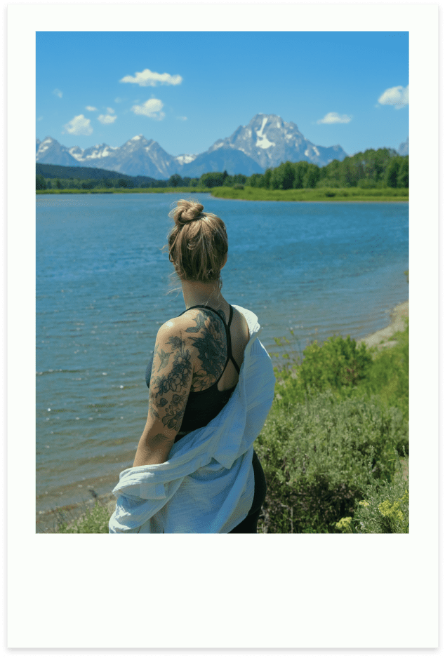 Woman admires mountain view over lake polaroid
